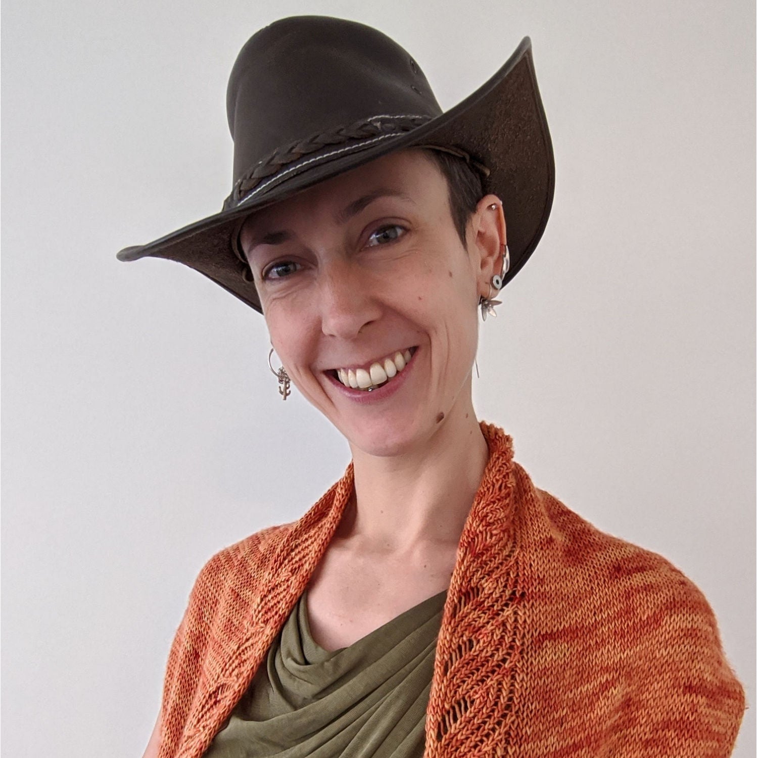 Person wearing cowboy hat and shawl