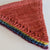 Stack of five hand knitted bunting hand dyed with natural dyes