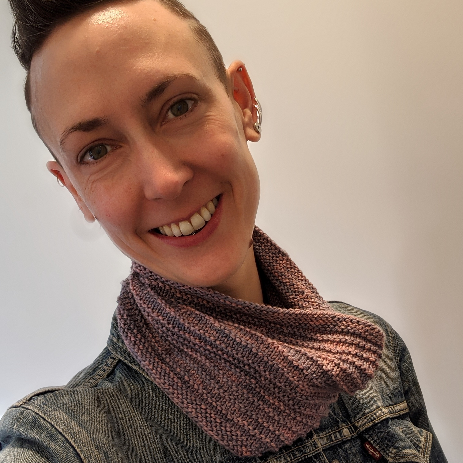 Person smiling wearing a cowl